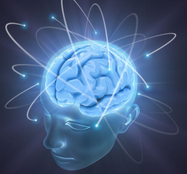 Illustrazione: una testa umana trasparente con il cervello in evidenza, attorno orbite luminose come quelle di un atomo.